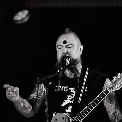 Man Singing Into Microphone With I Hate This Z Shirt GIF