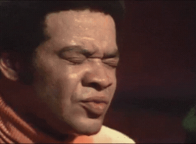 Man Singing Into Microphone With I Know On Chest GIF