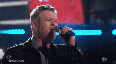 Man Singing Into Microphone With NBC Logo GIF