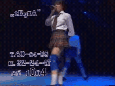 Man Singing Into Microphone With Number 1004 GIF