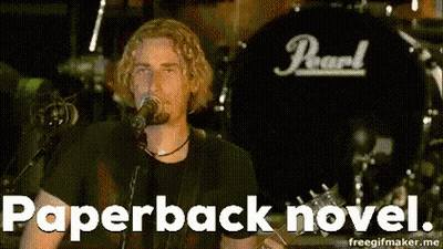 Man Singing Into Microphone With Pearl On Shirt GIF