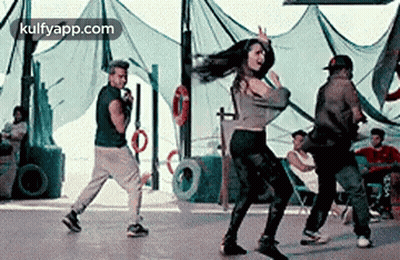 Man Singing Into Microphone Woman Dancing GIF