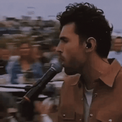 Man Singing Into Microphone GIF