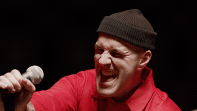 Man Singing Microphone In Red Shirt Black Beanie GIF