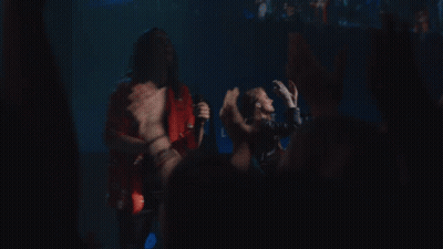 Man Singing On Stage With Band GIF