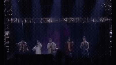 Man Singing Shirtless Into Microphone GIF