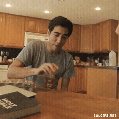 Man Sits At Table With Bible GIF