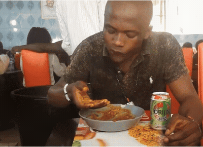 Man Sits at Table With Can of Origin Zero