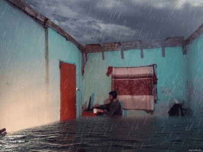 Man Sits In Flooded Room With Coffee GIF