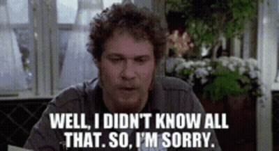 Man Sitting At A Table Saying Well I Didn't Know All That So I'm Sorry GIF