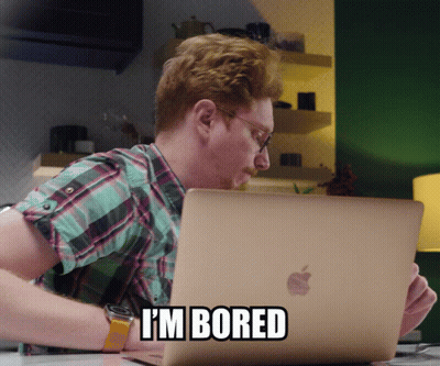 Man Sitting At Apple Laptop Saying I 'M Bored GIF