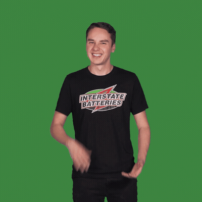 Man Sitting At Checkered Table Talking To Another Man GIF