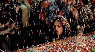 Man Sitting At Confetti Covered Table GIF