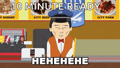 Man Sitting At Counter With 10 Minute Ready Sign GIF