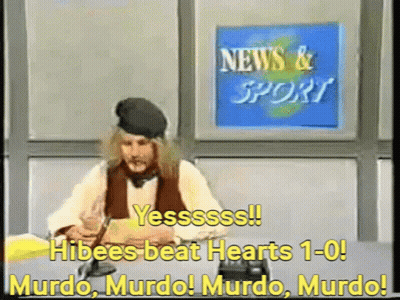 Man Sitting At Desk Before News And Sport Sign GIF