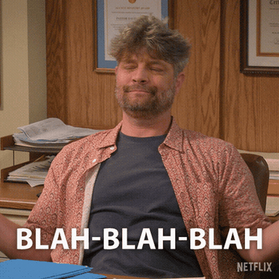 Man Sitting At Desk Eyes Closed Saying Blah Blah Blah GIF