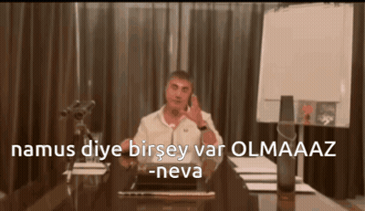 Man Sitting At Desk Talking On Cell Phone Namus Diye Birsey Var Olmaaz -Neva GIF