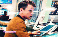 Man Sitting At Desk Using Tablet And Computer GIF