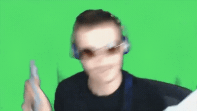 Man Sitting At Desk With Arm In Air GIF