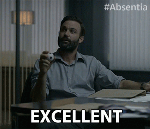 Man Sitting At Desk With Ball And Excellent GIF