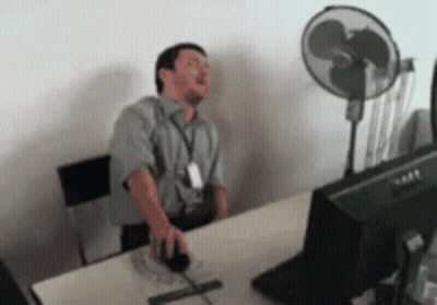 Man Sitting At Desk With Dell Computer Monitor GIF