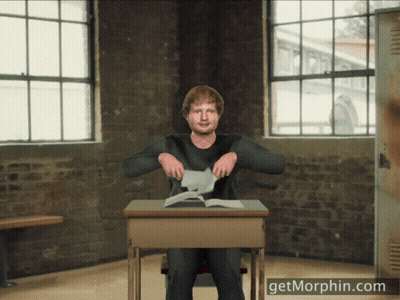 Man Sitting At Desk With Getmorphin.com GIF