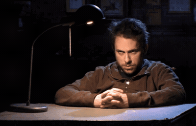Man Sitting At Desk With Hands Folded GIF
