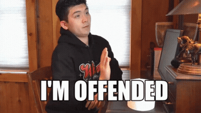 Man Sitting At Desk With I'm Offended On Screen GIF
