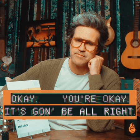 Man Sitting At Desk With Okay Sign GIF
