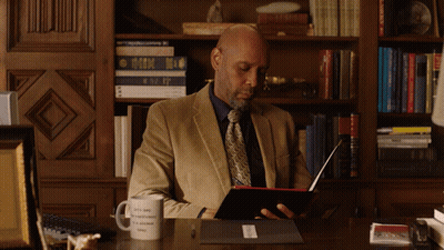 Man Sitting At Desk With Okay To Be Different Mug GIF