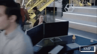 Man Sitting At Desk With SMP Sign GIF