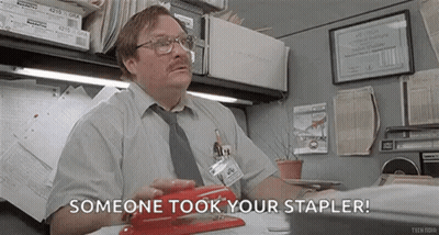 Man Sitting At Desk With Stapler GIF