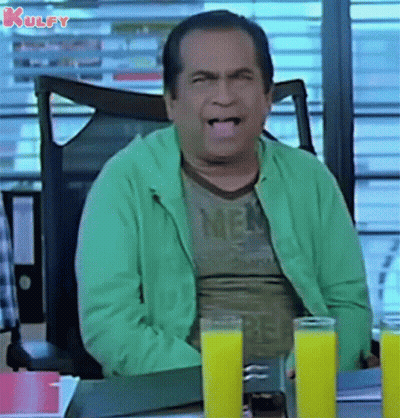 Man Sitting At Desk With Two Glasses Of Orange Juice GIF