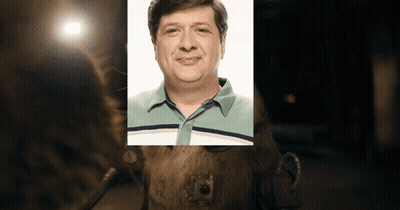 Man Sitting At Desk Writing GIF