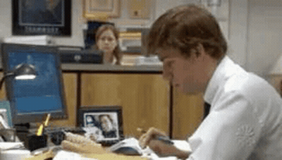 Man Sitting At Desk Writing GIF