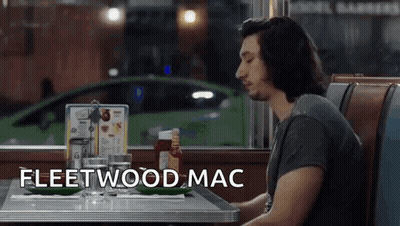 Man Sitting At Diner Table Saying Fleetwood Mac GIF