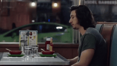 Man Sitting At Diner Table With Menu GIF