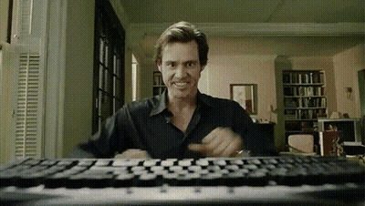 Man Sitting At Keyboard In Living Room GIF