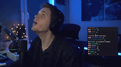 Man Sitting At Microphone Looking Up GIF
