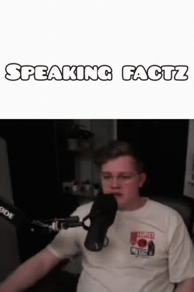 Man Sitting at Microphone Speaking Facts