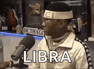 Man Sitting At Microphone With Gucci Headband GIF