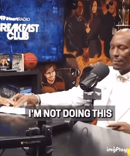Man Sitting At Microphone With I'm Not Doing This Text GIF