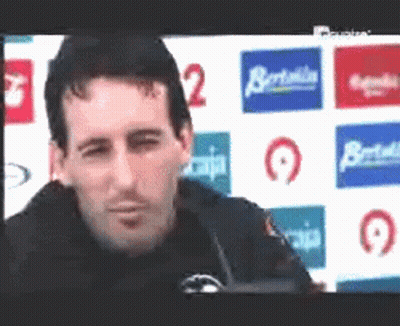 Man Sitting At Screen With Caja Logo GIF