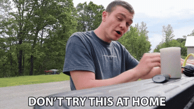 Man Sitting At Table Don't Try This At Home GIF