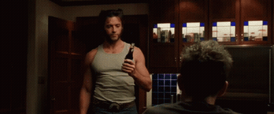 Man Sitting At Table Holding Beer GIF