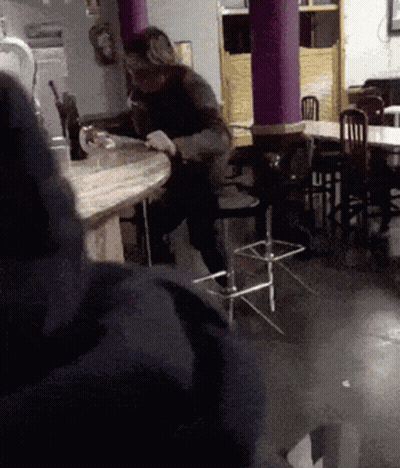 Man Sitting At Table In Restaurant GIF