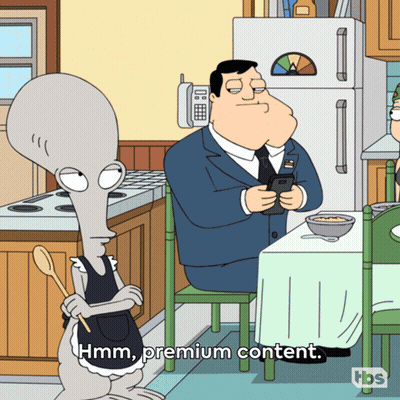 Man Sitting At Table Saying Hmm Premium Content GIF