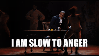 Man Sitting At Table Saying I Am Slow To Anger GIF