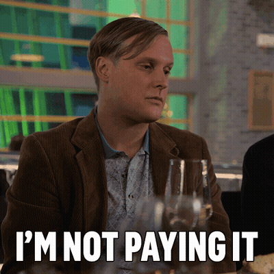 Man Sitting At Table Saying I'm Not Paying GIF