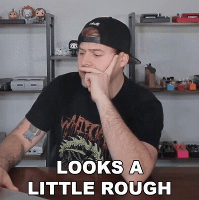 Man Sitting At Table Saying Looks A Little Rough GIF